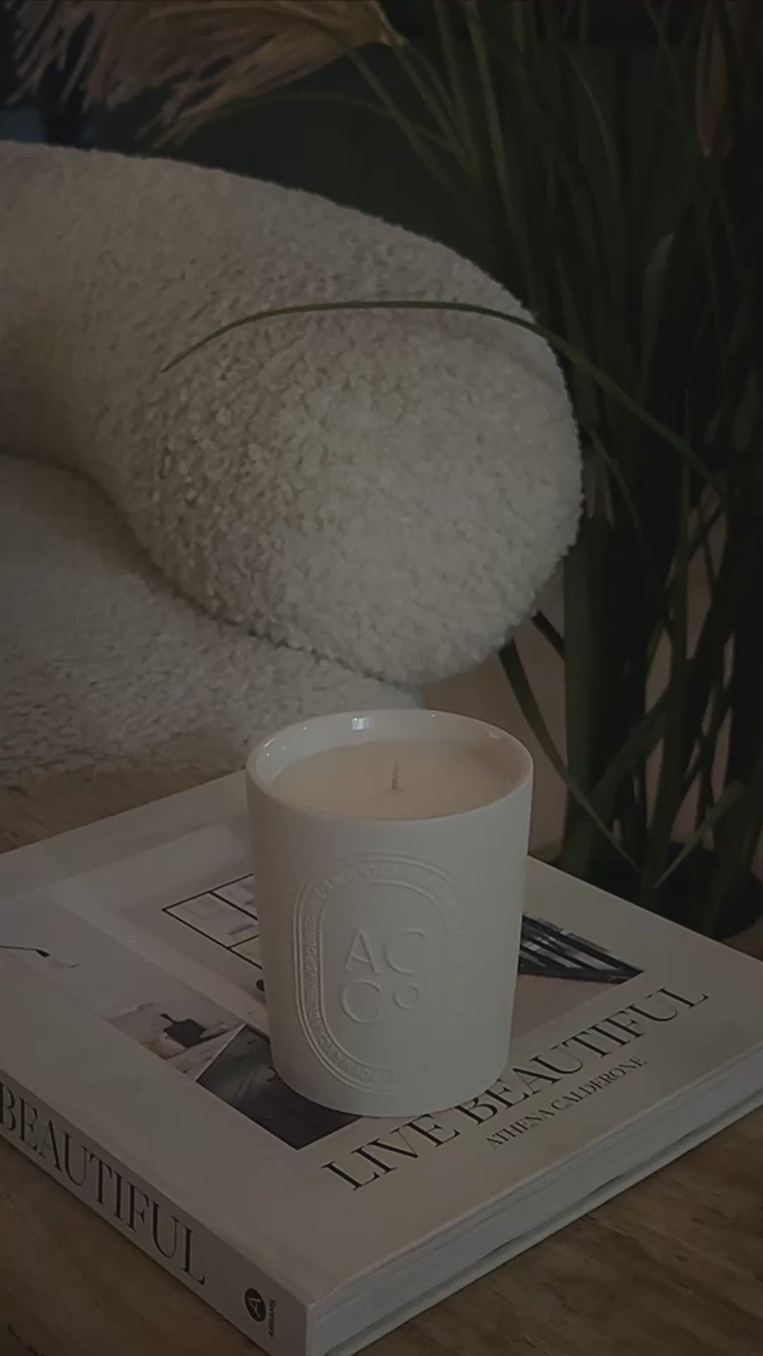 Ancient Candle Co Ambient light home scented candle being lit with a match